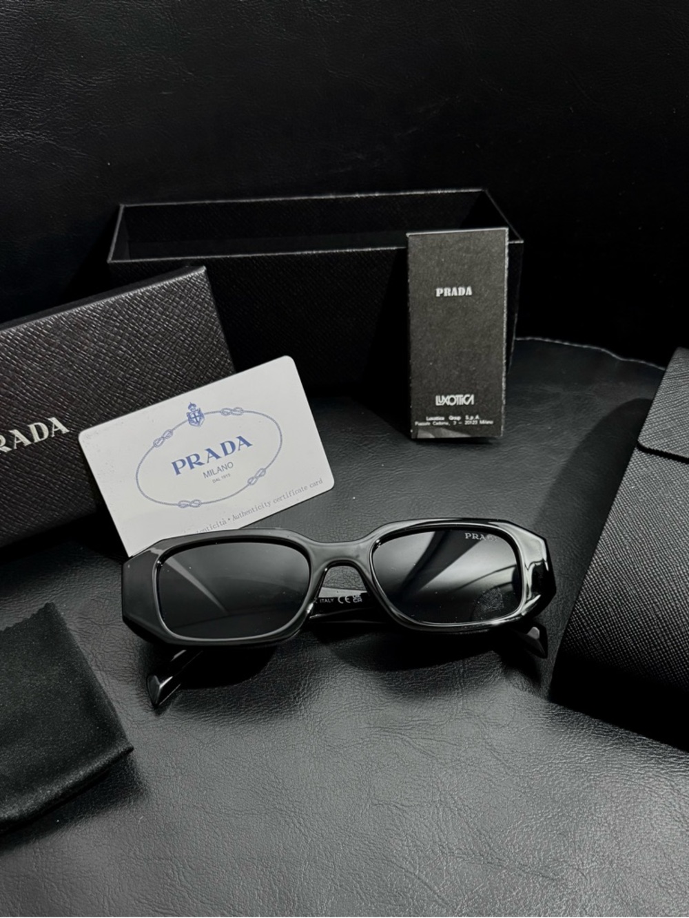 Prada Black Sunglasses with Dark Lenses